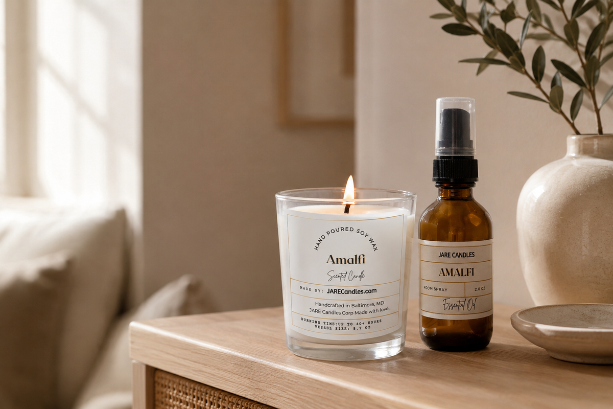 Lit Amalfi hand-poured soy wax candle in a clear glass tumbler from the JARE Candles Your Space collection