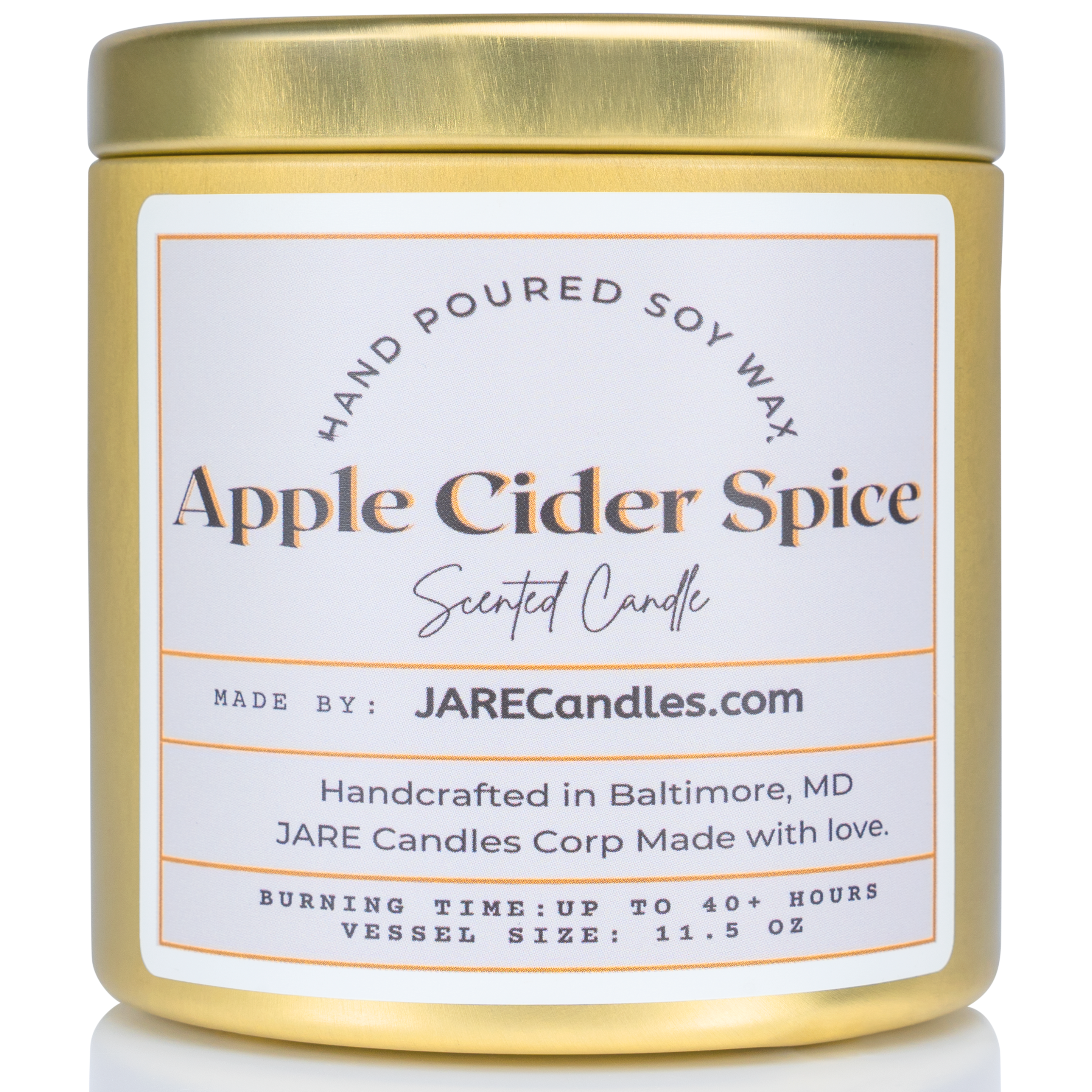 Close-up of JARE Candles' 'Apple Cider Spice' scented soy candle in a gold tin. The label highlights the handcrafted details, burn time of up to 40+ hours, and origin in Baltimore, MD. Candle size: 11.5 oz.