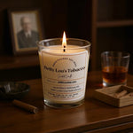 Betty Lou's Tobacco JARE soy candle on wooden surface with whiskey glass, sage honey amaretto fragrance styled shot
