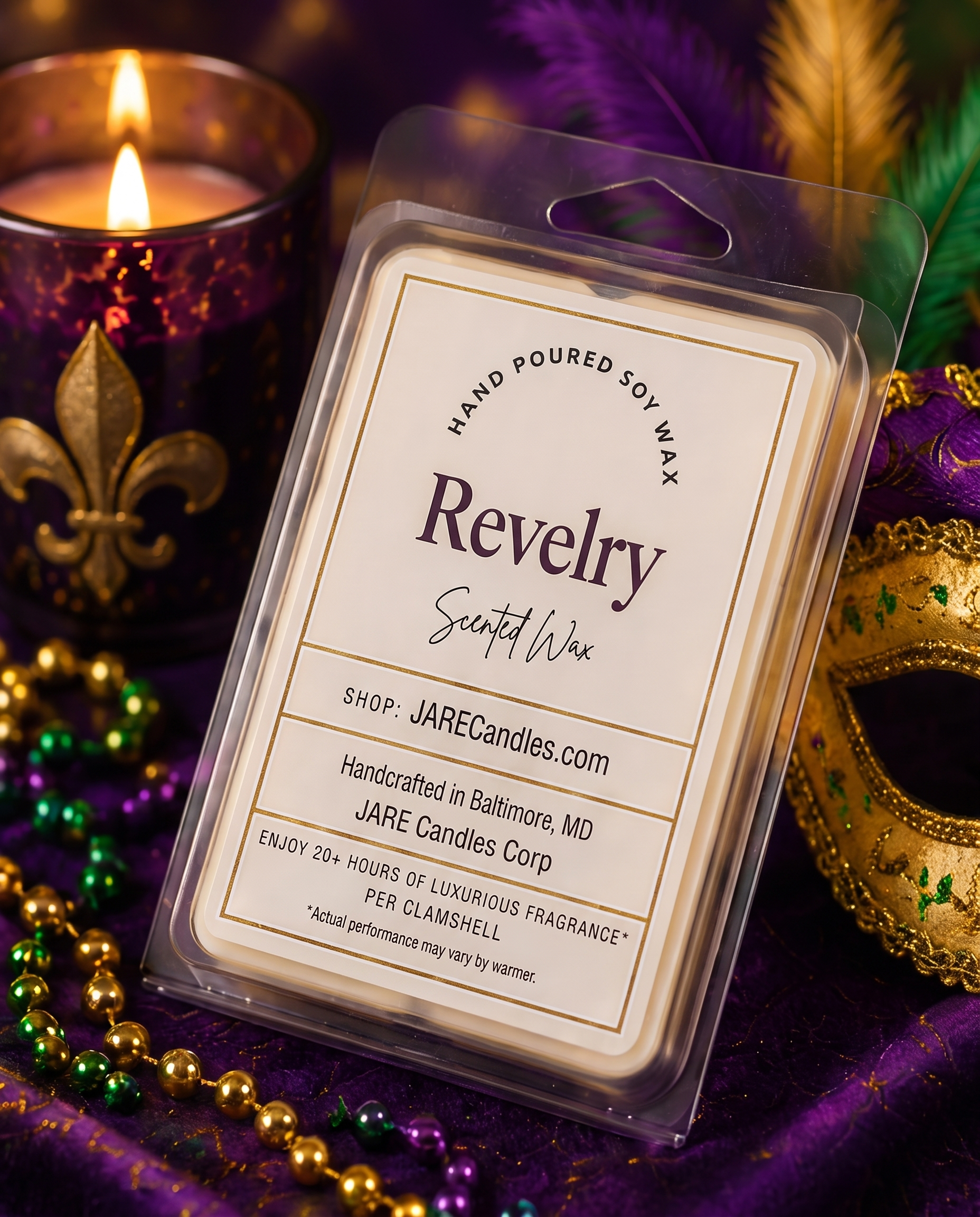 Revelry wax melts clamshell tilted on purple velvet beside a lit candle
