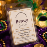 Revelry wax melts clamshell on purple velvet with gold and green beads