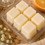 Six cream soy wax cubes in an open Sunday Brunch clamshell on a woven mat