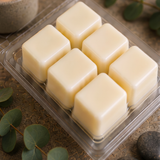 Six cream soy wax cubes in an open Retreat clamshell with eucalyptus sprigs