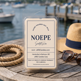 Noepe wax melts clamshell on a wooden table with a straw hat and sunglasses