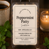 Peppermint Patty wax melts clamshell beside a chocolate peppermint patty and candlelight