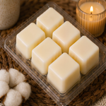 Six cream soy wax cubes in an open Like Home clamshell with cotton bolls