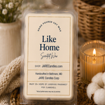 Like Home wax melts clamshell with cotton bolls and a lit ribbed glass candle