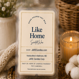 Like Home wax melts clamshell with cotton bolls and a lit ribbed glass candle