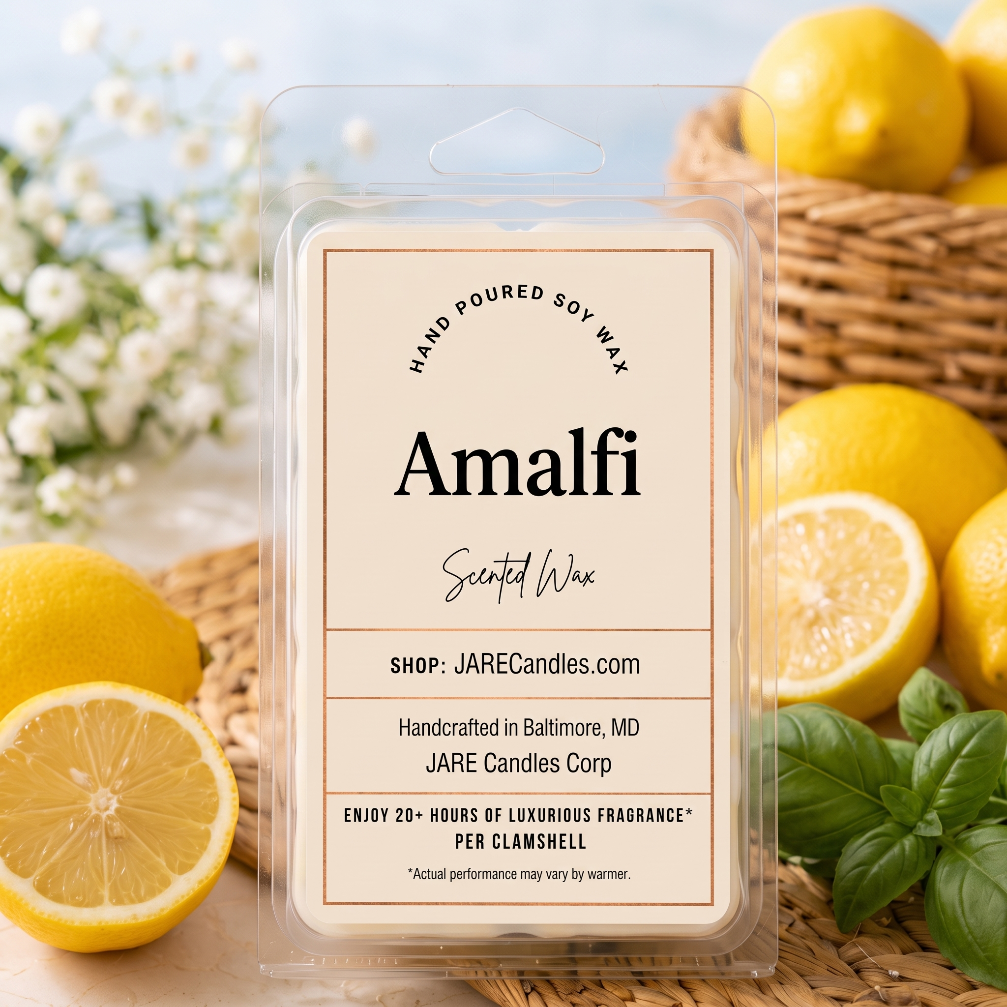 Amalfi scented wax melt clamshell by JARE Candles, surrounded by fresh lemons and basil leaves on a woven rattan mat in bright coastal daylight