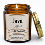 JAVA 5oz amber jar candle, lit, lid resting against jar