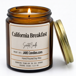 California Breakfast 5oz amber jar candle, lit, lid resting against jar
