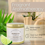 Retreat soy candle by JARE Candles surrounded by green leaves, lemongrass patchouli lime aromatherapy candle styled shot
